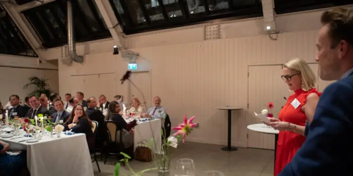 A photo of the John Lamb Hill Oldridge partners’ dinner, as directors Alex Gibson-Watt and Ken Maxwell present a speech.